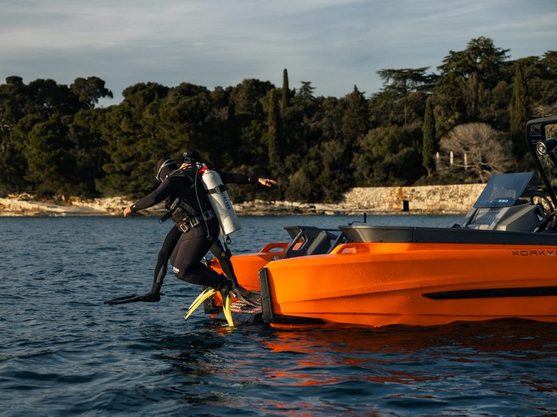 Diver entering the water from the platform of a Korkyra 650