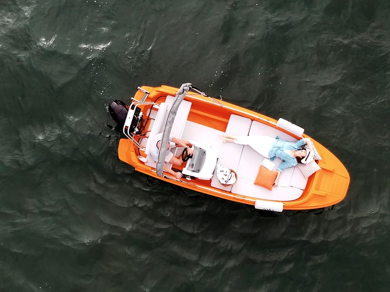 ROTO Nautica boat cruising with a full cushion set laid out