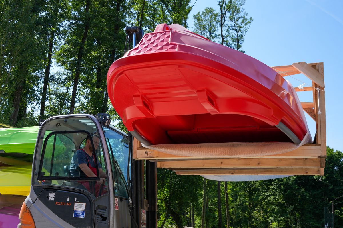 A finished rotationally moulded hull leaving the plant on a forklift